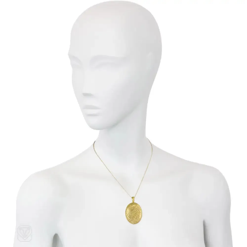 Antique gold double-sided engraved locket