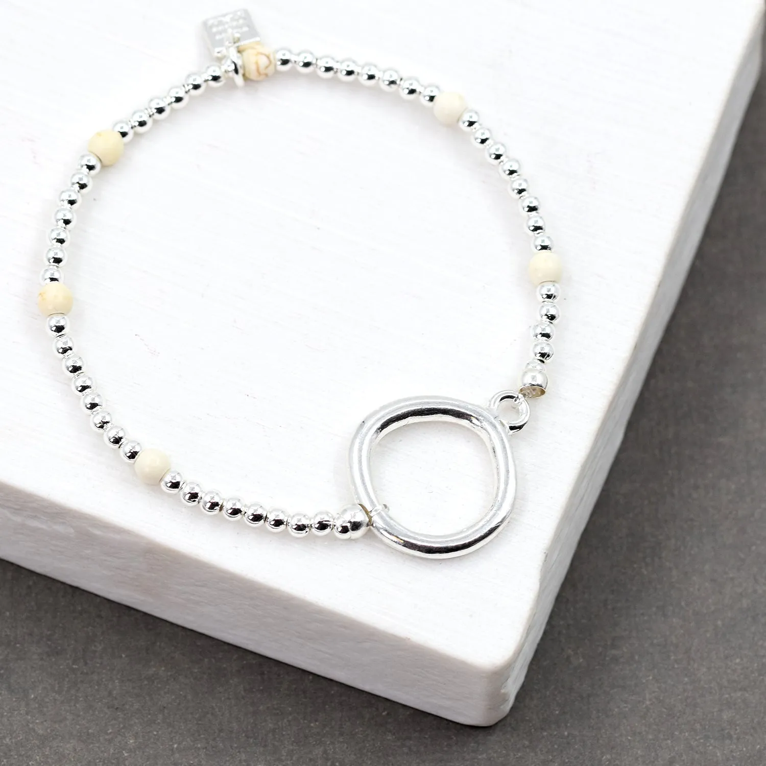 Beaded silver stretchy bracelet with bold circle detail