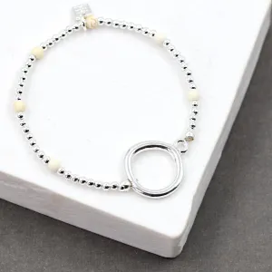 Beaded silver stretchy bracelet with bold circle detail