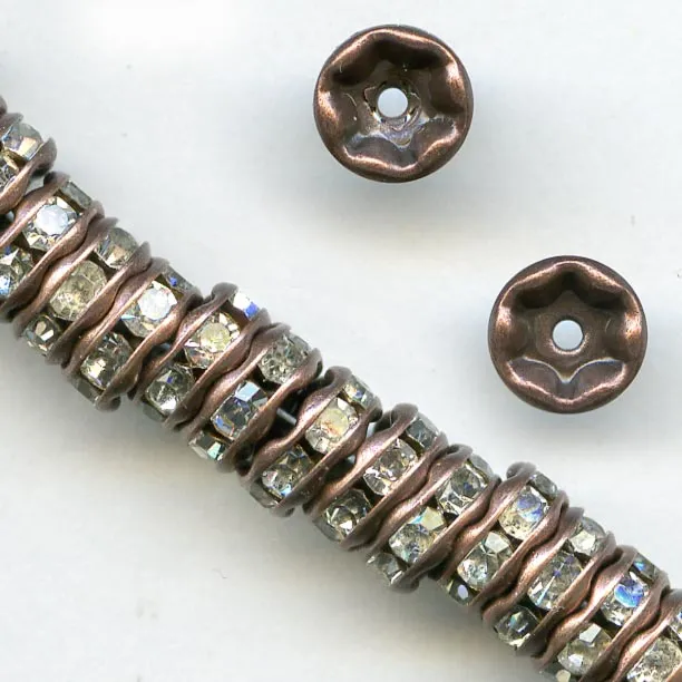 Clear rhinestone rondelle with antiqued copper. 4.5mm. Pkg of 4. b18-0270-1