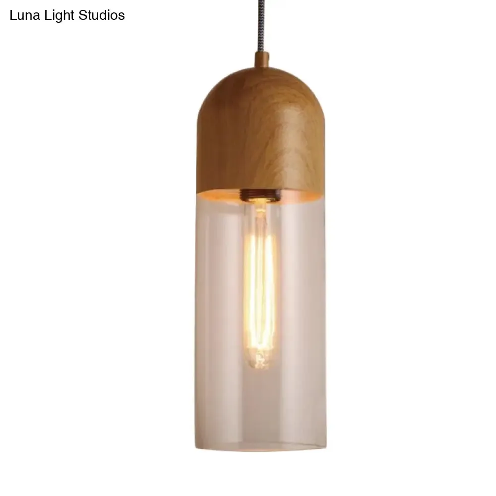 Modern Clear Glass Pendant Light: Sleek Half-Capsule Design, Wood Fixture for Bedroom