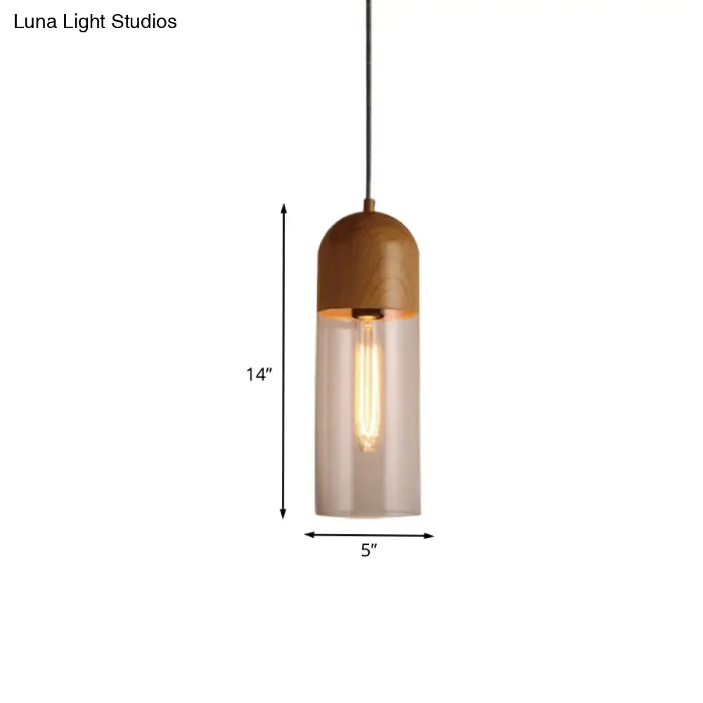 Modern Clear Glass Pendant Light: Sleek Half-Capsule Design, Wood Fixture for Bedroom