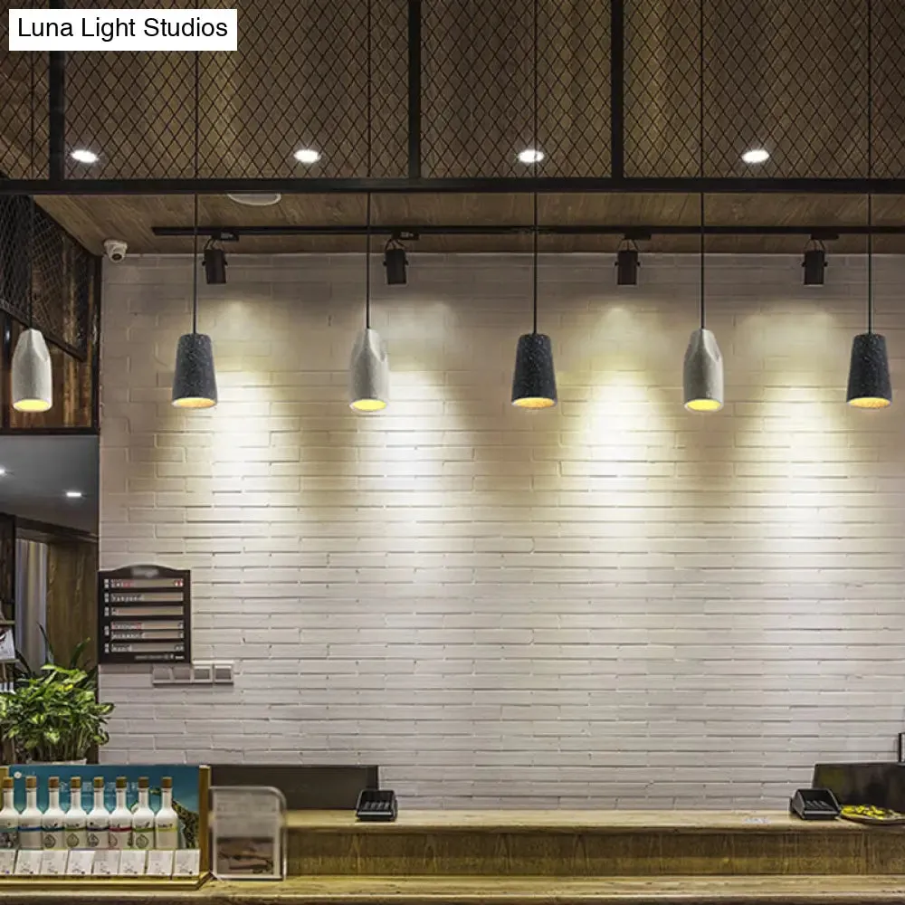 Sleek Single Pendant Light: Geometric Cement Ceiling Fixture for Modern Restaurants