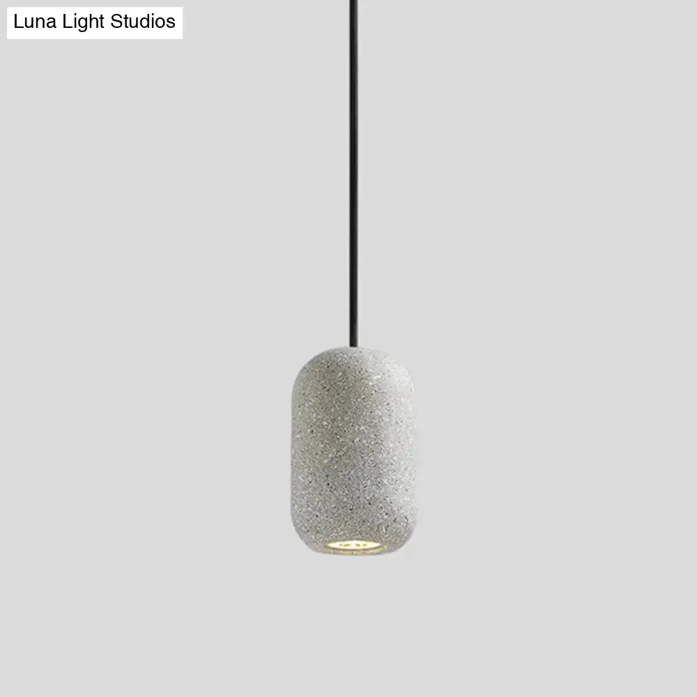 Sleek Single Pendant Light: Geometric Cement Ceiling Fixture for Modern Restaurants